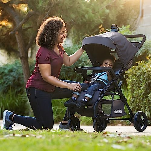 Baby Trend Passport Cargo stroller travel system with pink bamboo EZ-Lift infant car seat and adjustable handlebar.