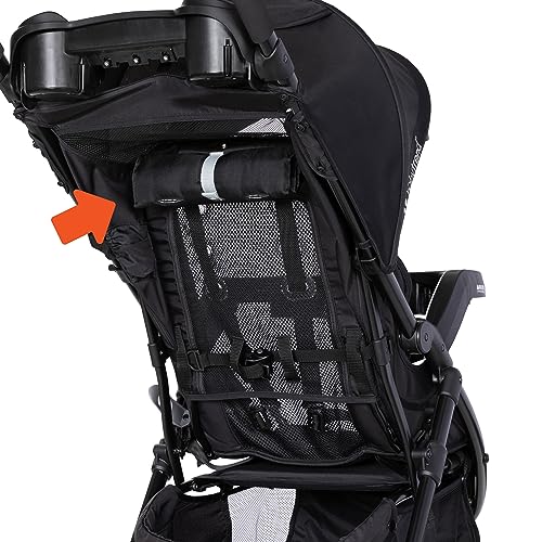 Pink Bamboo Baby Trend Passport cargo stroller with EZ-Lift Plus infant car seat, featuring a child seated inside and stroller wheels visible