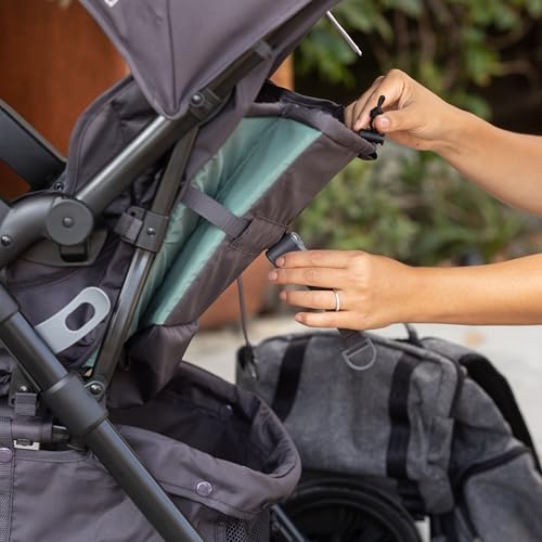 Pink Baby Trend Passport Cargo Stroller with EZ-Lift Plus infant car seat, featuring bamboo accents and adjustable handlebar.