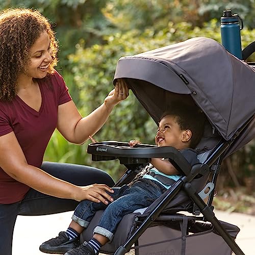 Pink Baby Trend Passport Cargo Stroller with EZ-Lift Plus infant car seat, featuring a pink bamboo pattern, suitable for travel.