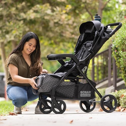 Pink Bamboo Baby Trend Passport cargo stroller with EZ-Lift Plus infant car seat, featuring a pink fabric design and sturdy frame.