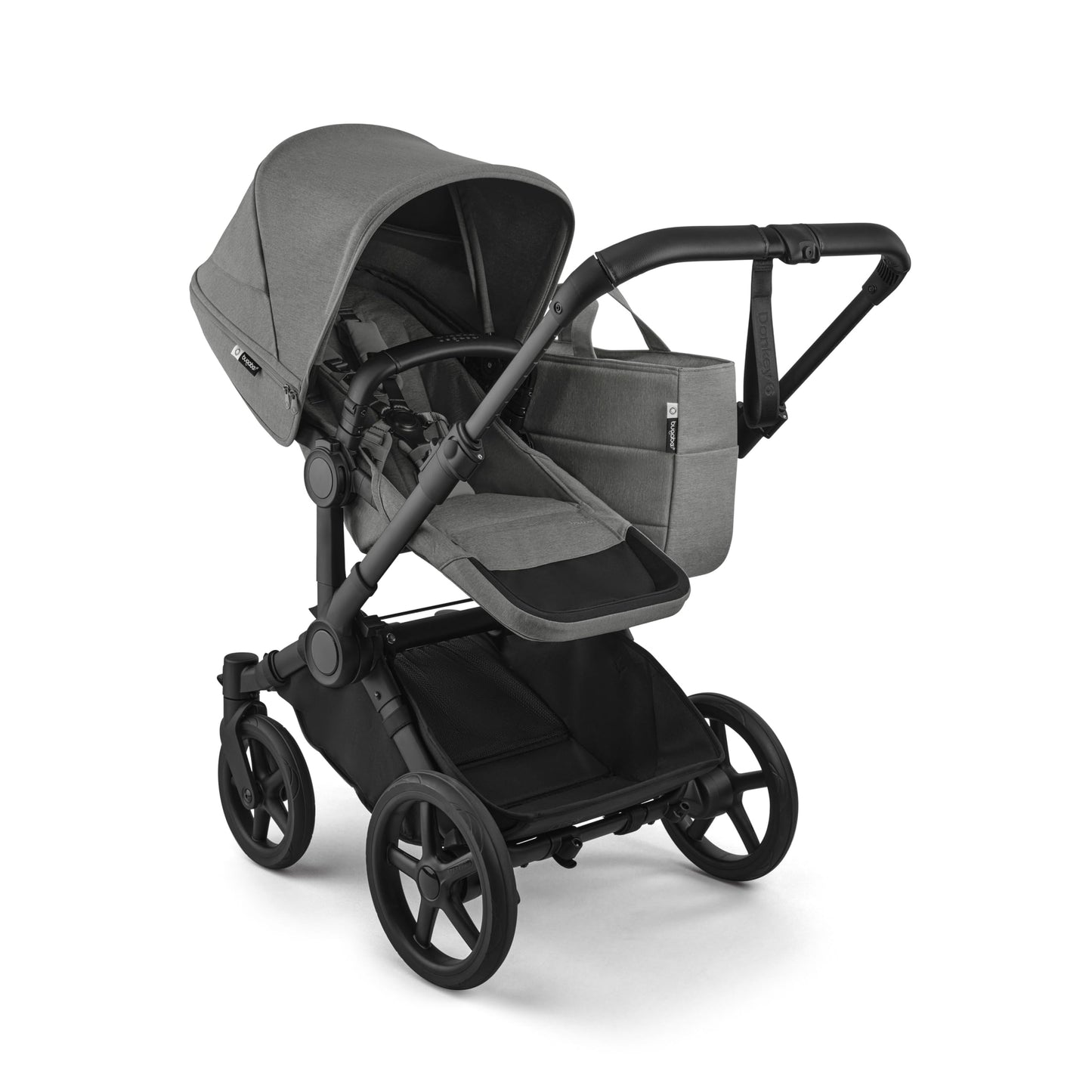 Bugaboo Donkey 6 single-to-double all-terrain stroller in cocoa brown with adjustable seats for newborn and toddler.
