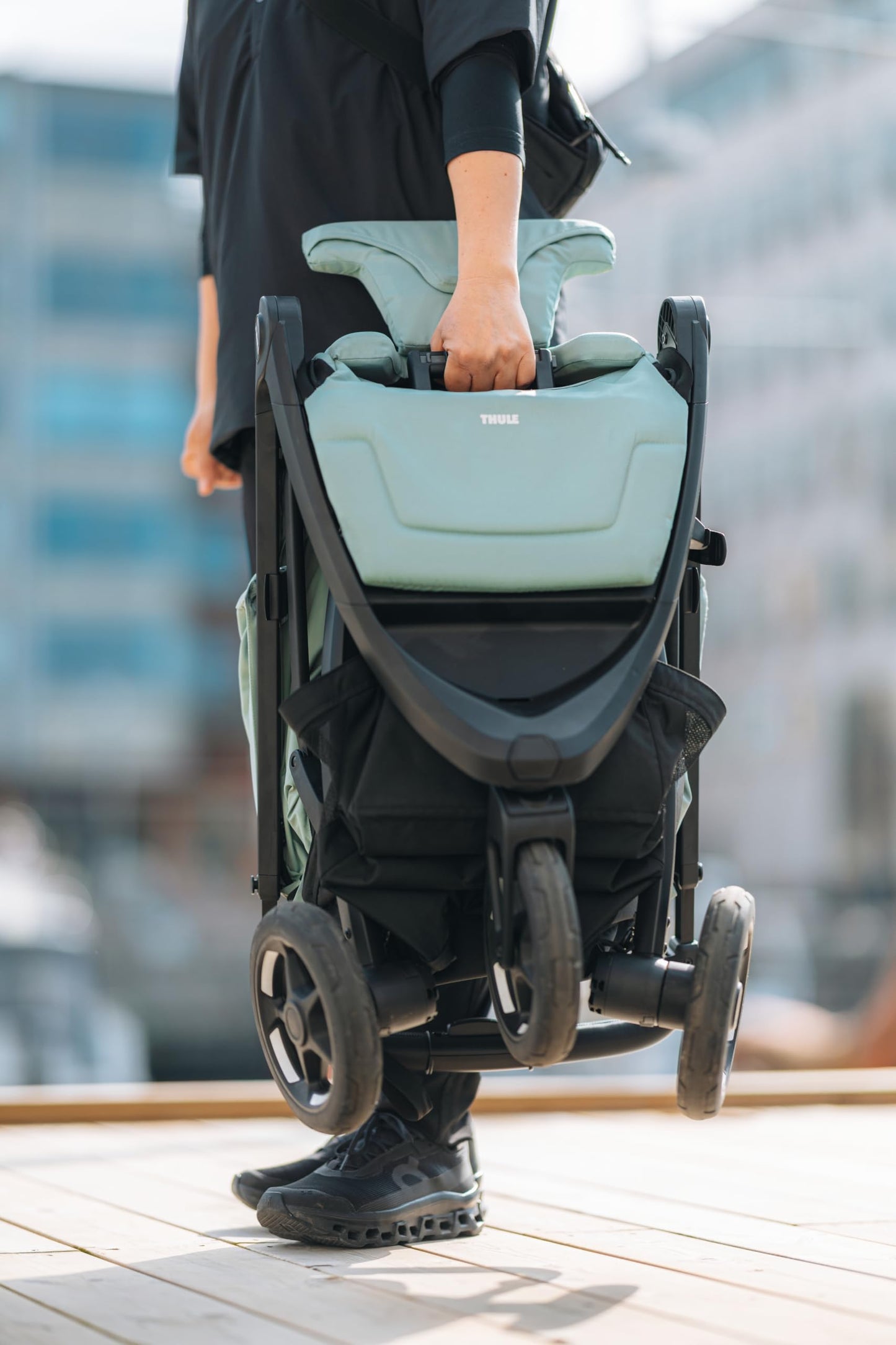 Thule Spring 2 single child stroller with ventilated canopy, adjustable handlebar, lightweight design, compact fold, in black color.