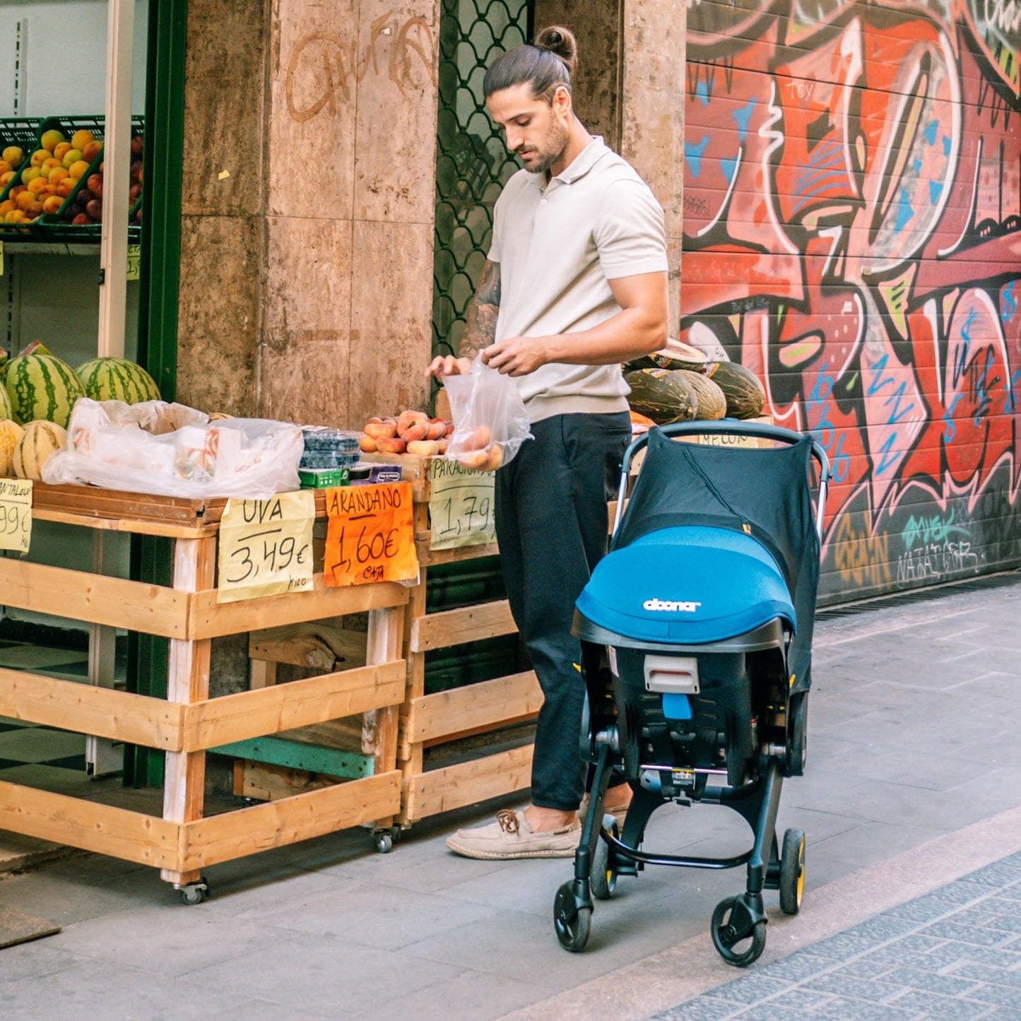 Doona all-in-one travel system with slate green car seat and stroller, compact and versatile for easy baby transport