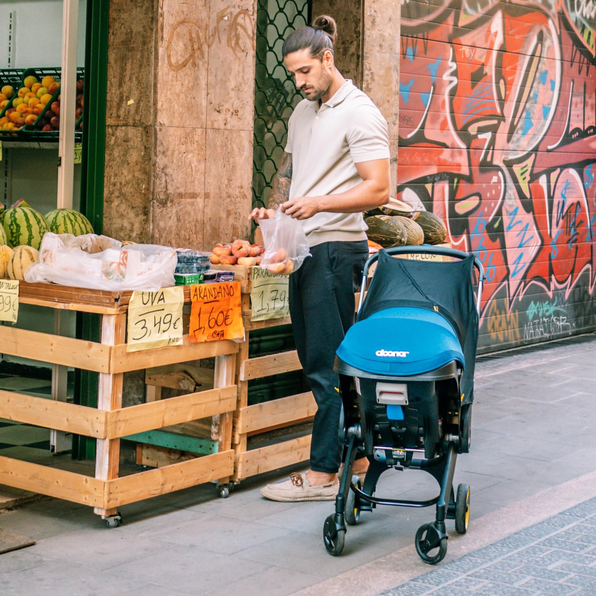 Doona all-in-one travel system with slate green car seat and stroller, compact and versatile for easy baby transport