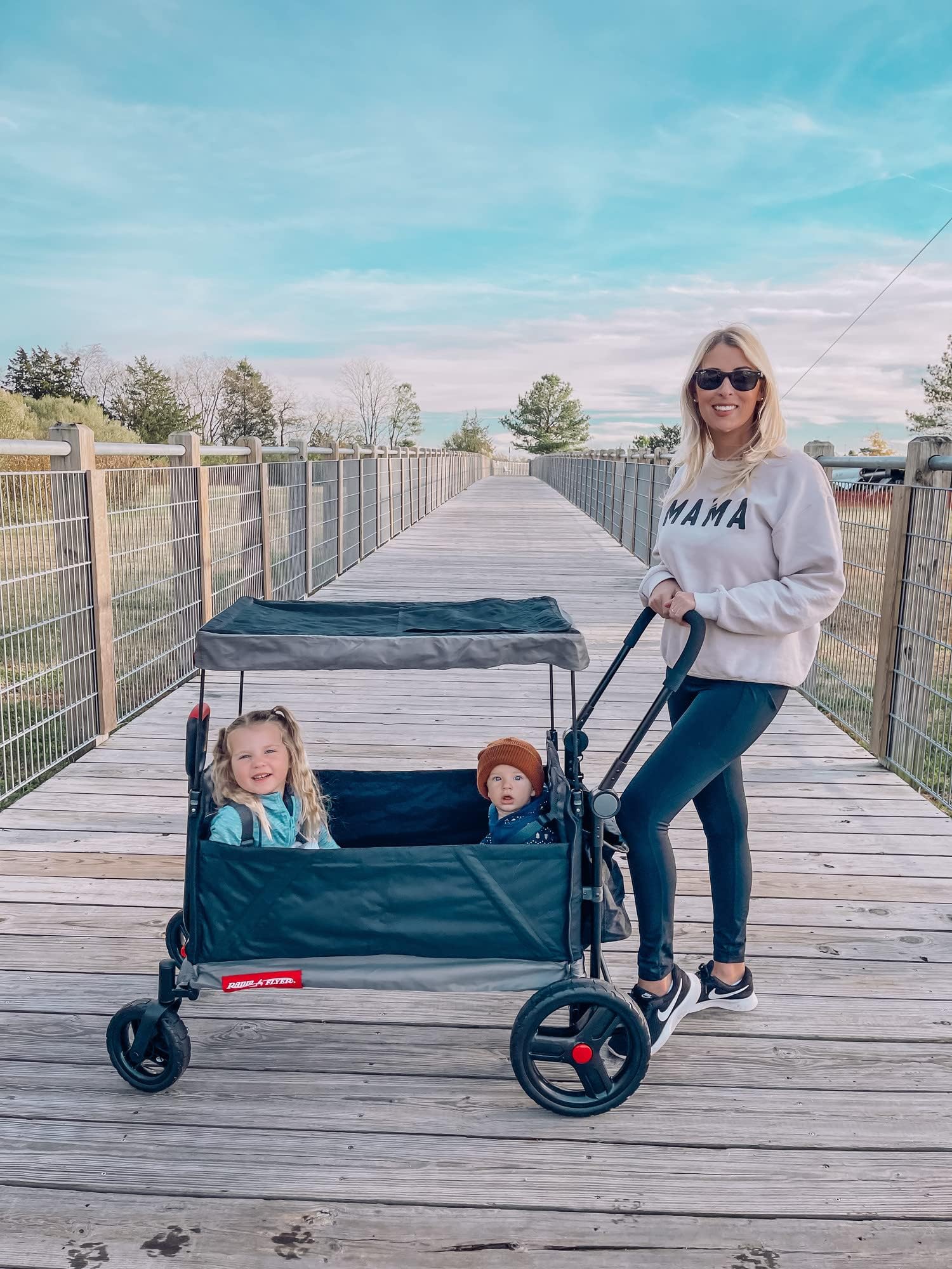 Red Radio Flyer wagon for kids with wheels, convertible stroller and rolling cart, outdoor toy for toddlers aged 1+ years.